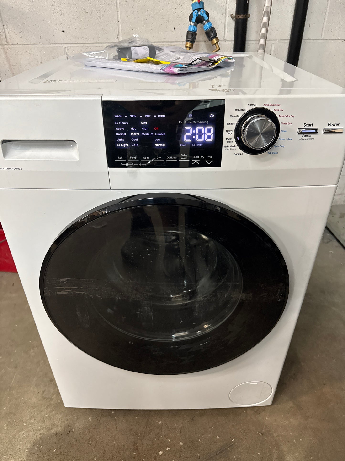 Combinaison laveuse et sécheuse GE Appliances blanc de 2,4 pi³ sans évacuation avec cycles à vapeur GFQ14ESSNWW